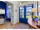 Foyer with desk, view to office, and blue double-doors with front yard view at 6018 Abbey Oaks Dr, Lakeland, FL 33811