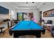 Bright game room with pool table, outdoor views, and access to the backyard pool at 6018 Abbey Oaks Dr, Lakeland, FL 33811