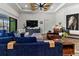 Bright living room with hardwood floors and view to the screened-in pool at 6018 Abbey Oaks Dr, Lakeland, FL 33811