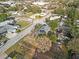 Aerial view of the home and neighborhood, showing the proximity to industrial buildings at 602 E Orange St, Auburndale, FL 33823