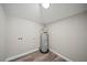 Small laundry room with utility hook ups and a hot water heater at 602 E Orange St, Auburndale, FL 33823