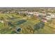 An aerial view showcases a lush golf course winding through a residential community at 6224 Crane Dr, Lakeland, FL 33809