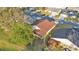 An aerial view showing a home with a large tree, screened-in porch, and pergola at 6224 Crane Dr, Lakeland, FL 33809