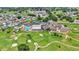 An aerial view of the community showcasing the pool, tennis courts, clubhouse, and golf course at 6224 Crane Dr, Lakeland, FL 33809