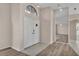 Entryway with modern floors, a mirror, and a view into the home at 6224 Crane Dr, Lakeland, FL 33809