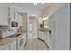 Bright kitchen with white appliances, marble countertops, and tile flooring at 6224 Crane Dr, Lakeland, FL 33809