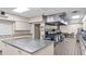 Commercial kitchen with stainless steel island, ample counter space, and professional-grade appliances at 6224 Crane Dr, Lakeland, FL 33809