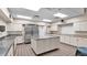 Spacious commercial kitchen featuring stainless steel appliances, a large island, and ample counter space at 6224 Crane Dr, Lakeland, FL 33809