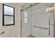 Updated shower with white subway tile and glass door at 6224 Crane Dr, Lakeland, FL 33809