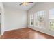 Bright bedroom with vaulted ceilings and wood floors filled with natural light from the large windows at 623 Nicholson Dr, Davenport, FL 33837