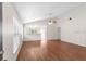 Bright living room featuring vaulted ceiling and wood flooring, connecting seamlessly to other spaces at 623 Nicholson Dr, Davenport, FL 33837