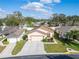 Aerial view of a single-Gathering home with well-maintained landscaping, complemented by neighboring residences at 6271 Res Cir, Lakeland, FL 33810