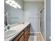 Bathroom featuring double sinks, vanity and a walk-in shower at 6271 Res Cir, Lakeland, FL 33810