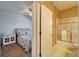 Bathroom and bedroom view through doorway, offering a convenient layout and a glimpse of the relaxing retreat at 6271 Res Cir, Lakeland, FL 33810