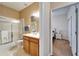 Bathroom and bedroom view through doorway, offering a convenient layout and a glimpse of the relaxing retreat at 6271 Res Cir, Lakeland, FL 33810