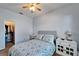 Bedroom featuring a large window, carpet flooring, and a ceiling fan at 6271 Res Cir, Lakeland, FL 33810