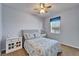 Bedroom featuring a large window, carpet flooring, and a ceiling fan at 6271 Res Cir, Lakeland, FL 33810