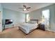 Bedroom featuring a large window, carpet flooring, and a ceiling fan at 6271 Res Cir, Lakeland, FL 33810