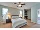 Comfortable bedroom with neutral walls, carpet flooring, and a ceiling fan at 6271 Res Cir, Lakeland, FL 33810