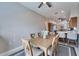 View of the dining room with seating for six, located close to the kitchen and living area at 6271 Res Cir, Lakeland, FL 33810