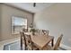 Sun filled dining area with a wood table, seating for six and a calming decor at 6271 Res Cir, Lakeland, FL 33810