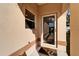 Close-up view of the home's entrance, featuring a charming doormat and a well-lit entryway at 6271 Res Cir, Lakeland, FL 33810