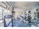 This home gym features multiple machines, blue carpet, and natural light at 6271 Res Cir, Lakeland, FL 33810