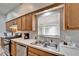 Well-equipped kitchen with stainless steel appliances and a double-basin sink at 6271 Res Cir, Lakeland, FL 33810