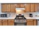 Close up shot of stainless steel range and appliances surrounded by lots of cabinet space at 6271 Res Cir, Lakeland, FL 33810