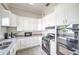 Well-equipped kitchen with white cabinetry, granite countertops, and stainless steel appliances at 6271 Res Cir, Lakeland, FL 33810