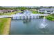 Scenic view of a pond with a white bridge and fountain in a residential community at 6271 Res Cir, Lakeland, FL 33810