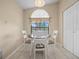 Dining area featuring neutral walls, white chair, and a modern light fixture at 6337 Egret Dr, Lakeland, FL 33809