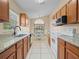 Bright kitchen featuring granite countertops, wood cabinets, and modern appliances at 6337 Egret Dr, Lakeland, FL 33809