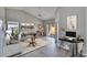 Cozy living room with neutral tones and ample natural light at 6610 Shepherd Oaks St, Lakeland, FL 33811