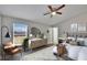 Serene main bedroom featuring a ceiling fan and lots of natural light at 6610 Shepherd Oaks St, Lakeland, FL 33811