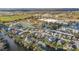 Aerial view of lakefront homes with water access, near local businesses in a serene, established neighborhood at 6838 Shimmering Dr, Lakeland, FL 33813