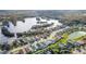 Aerial view of lakefront homes with water access, near local businesses in a serene, established neighborhood at 6838 Shimmering Dr, Lakeland, FL 33813