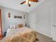 Neutral bedroom featuring medium tone carpet and a ceiling fan at 6838 Shimmering Dr, Lakeland, FL 33813