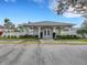 Charming clubhouse featuring a welcoming entrance, well-manicured landscaping, and ample parking at 6838 Shimmering Dr, Lakeland, FL 33813