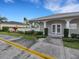 Inviting clubhouse features white double doors, trimmed shrubbery, and sidewalk access at 6838 Shimmering Dr, Lakeland, FL 33813