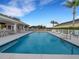 Community pool area offers a large, refreshing swimming pool with ample seating and lounge chairs at 6838 Shimmering Dr, Lakeland, FL 33813