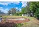 Landscaped backyard with a decorative stone pathway and lush plantings at 6846 Ashbury Dr, Lakeland, FL 33809