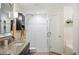 Modern bathroom boasting a stand-up shower, granite counters, and a single sink at 6846 Ashbury Dr, Lakeland, FL 33809