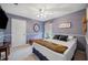 Cozy bedroom featuring carpet, modern ceiling fan and a decorative design at 6846 Ashbury Dr, Lakeland, FL 33809