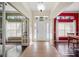 Bright foyer with beige walls, tile flooring, and a decorative transom window above the front door at 6846 Ashbury Dr, Lakeland, FL 33809