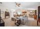 Living room featuring comfortable seating, access to the kitchen, and natural light at 6846 Ashbury Dr, Lakeland, FL 33809