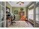 Well-lit office with desk, chair, and decorative shelving, ideal for remote work at 6846 Ashbury Dr, Lakeland, FL 33809