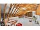 Unfinished attic space with exposed rafters and beams, showing potential for future living space at 6942 Indian Creek Park Dr, Lakeland, FL 33813