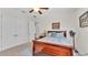 Cozy bedroom featuring a ceiling fan, double door closet, and bright window light at 6942 Indian Creek Park Dr, Lakeland, FL 33813