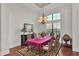 Elegant dining room with chandelier and large window at 6942 Indian Creek Park Dr, Lakeland, FL 33813